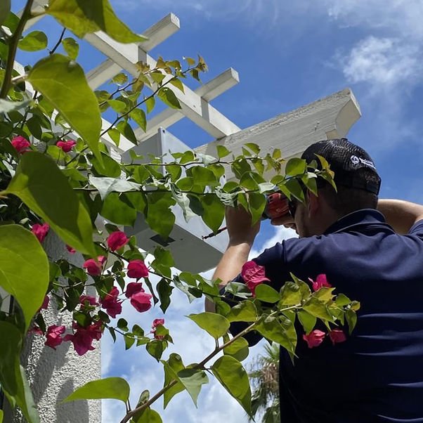 Technician working on an outdoor structure.