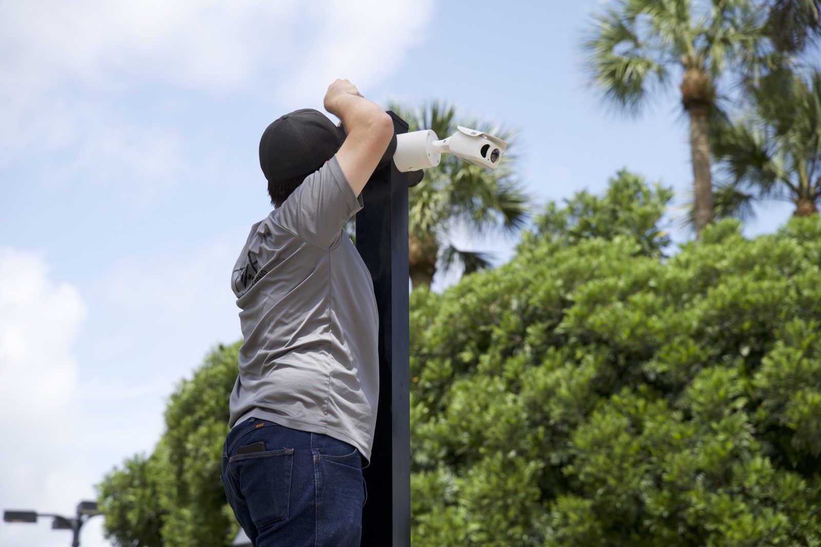 STAR technician installing an outdoor security camera