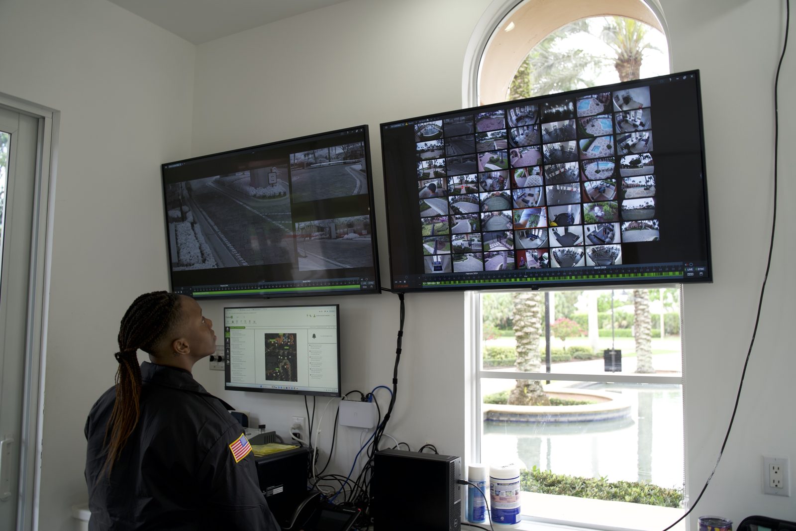 Security officer working at a community security workstation
